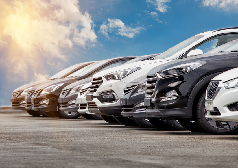 A fleet of automotive vehicles lined up