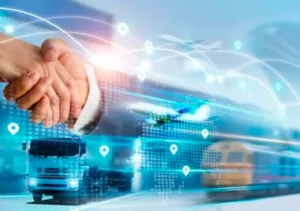 A picture of two people shaking hands against a backdrop of technology