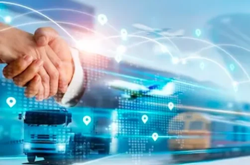 A picture of two people shaking hands against a backdrop of technology