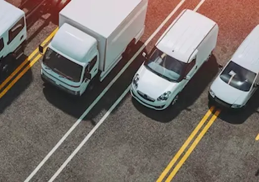 A picture of internal combustion engine-powered vehicles on the freeway driving
