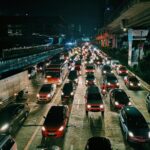 A picture of EV and ICE vehicles on a crowded freeway road