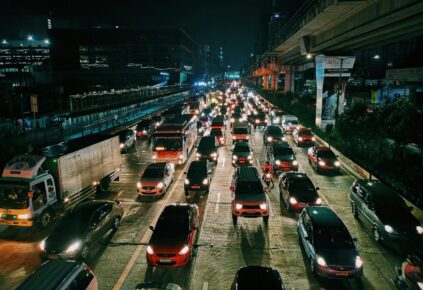 A picture of EV and ICE vehicles on a crowded freeway road
