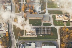 An aerial view of a smoke stack at an industrial facility