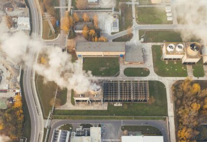 An aerial view of a smoke stack at an industrial facility