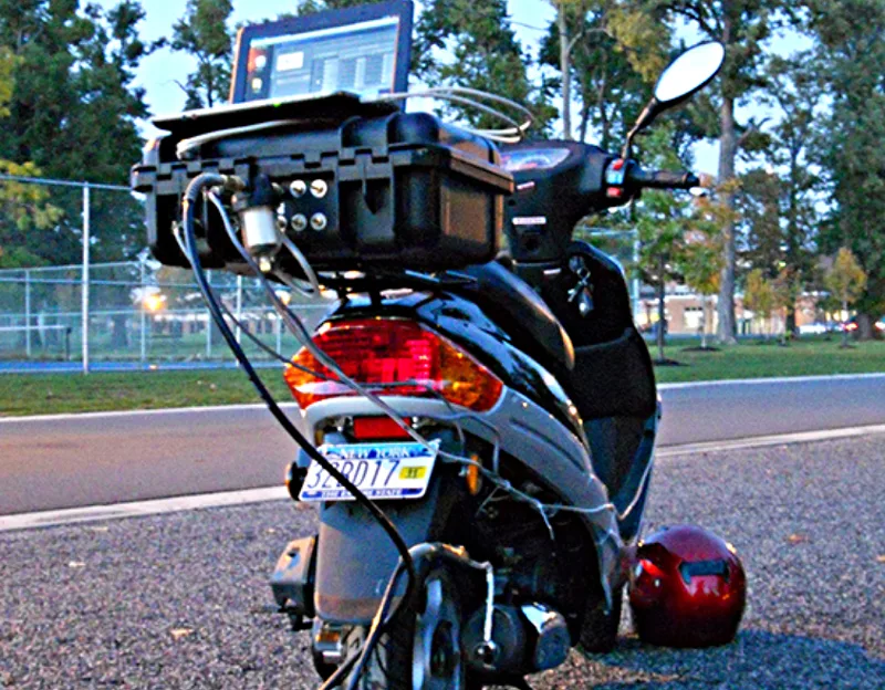 A picture of a portable gas detection system ready for motorcycle emissions testing